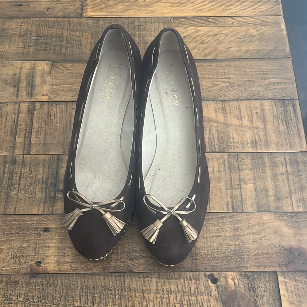 Never worn, Suede material at the top and braided pattern for the wedge.